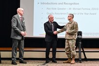 Dr. John Plifka, U.S. Army Training and Doctrine Command (TRADOC) quality assurance director (left), and Michael Formica, Executive Deputy to the TRADOC Commanding General, present an award to Sgt. 1st Class Gerald Funk (right) as he is named the TRADOC quality assurance evaluator of the year at a U.S. Army quality assurance program forum at Fort Eustis, Va. March 4, 2025. (Courtesy photo)