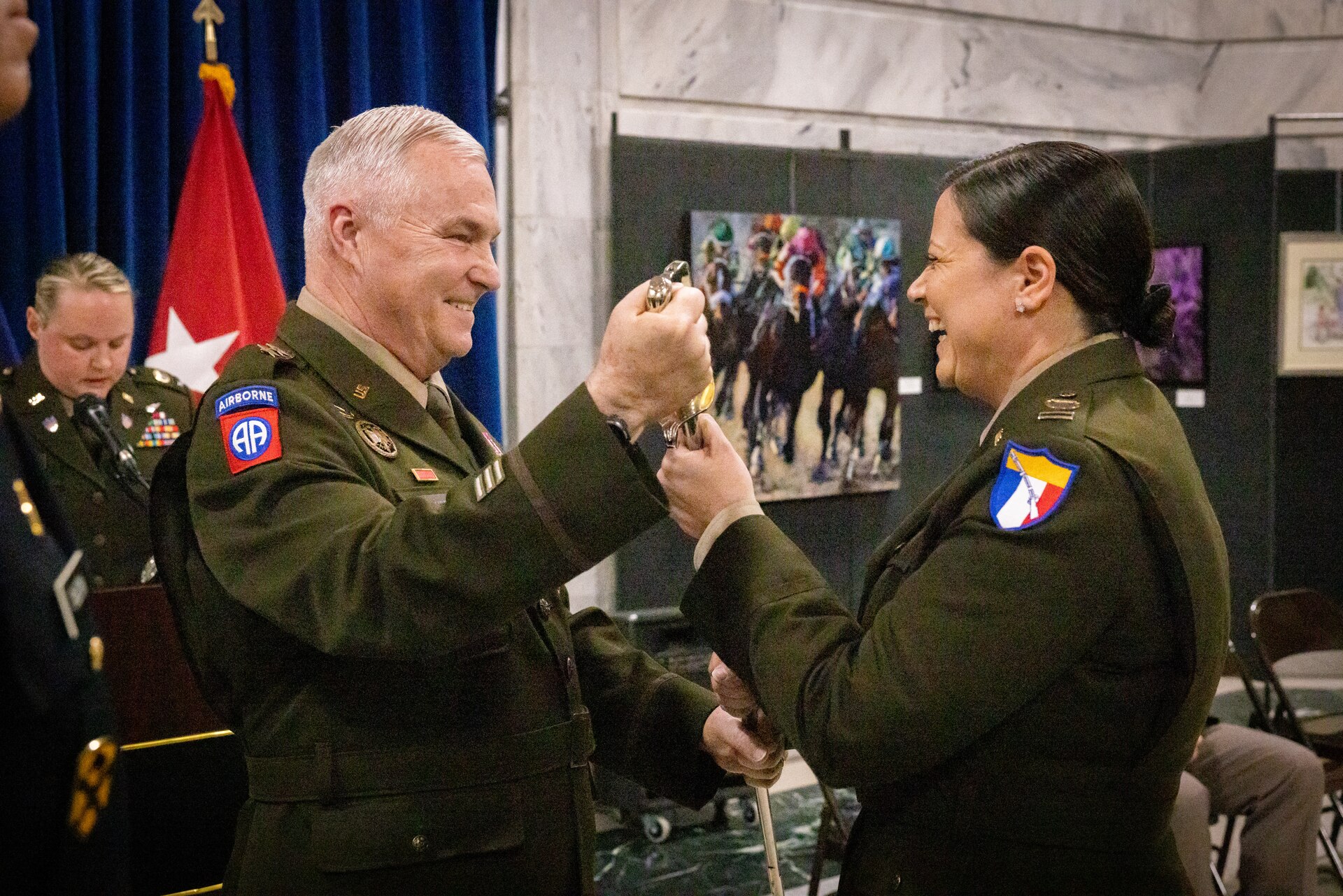 U.S. Army Command Chief Warrant Officer 5 Jennifer Ritchie (right), receives the warrant officer’s saber from Maj. Gen. Haldane Lamberton, Kentucky’s adjutant general, at the command chief warrant officer change of responsibility at the State Capitol Rotunda in Frankfort, Ky. on April 29, 2025. Ritchie was appointed as the Kentucky Army National Guard command chief warrant officer during the ceremony, held previously by Chief Warrant Officer 5 Rickey Skelton. (U.S. Army photo by Andy Dickson)