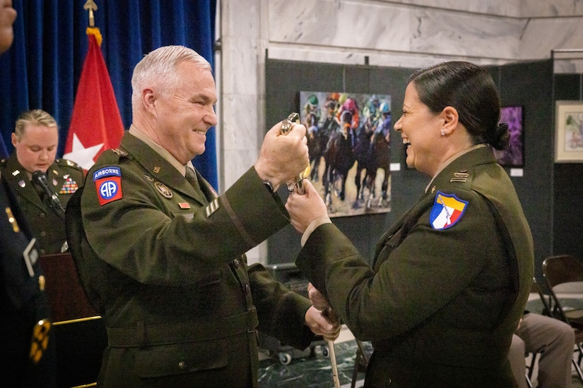 U.S. Army Command Chief Warrant Officer 5 Jennifer Ritchie (right), receives the warrant officer’s saber from Maj. Gen. Haldane Lamberton, Kentucky’s adjutant general, at the command chief warrant officer change of responsibility at the State Capitol Rotunda in Frankfort, Ky. on April 29, 2025. Ritchie was appointed as the Kentucky Army National Guard command chief warrant officer during the ceremony, held previously by Chief Warrant Officer 5 Rickey Skelton. (U.S. Army photo by Andy Dickson)