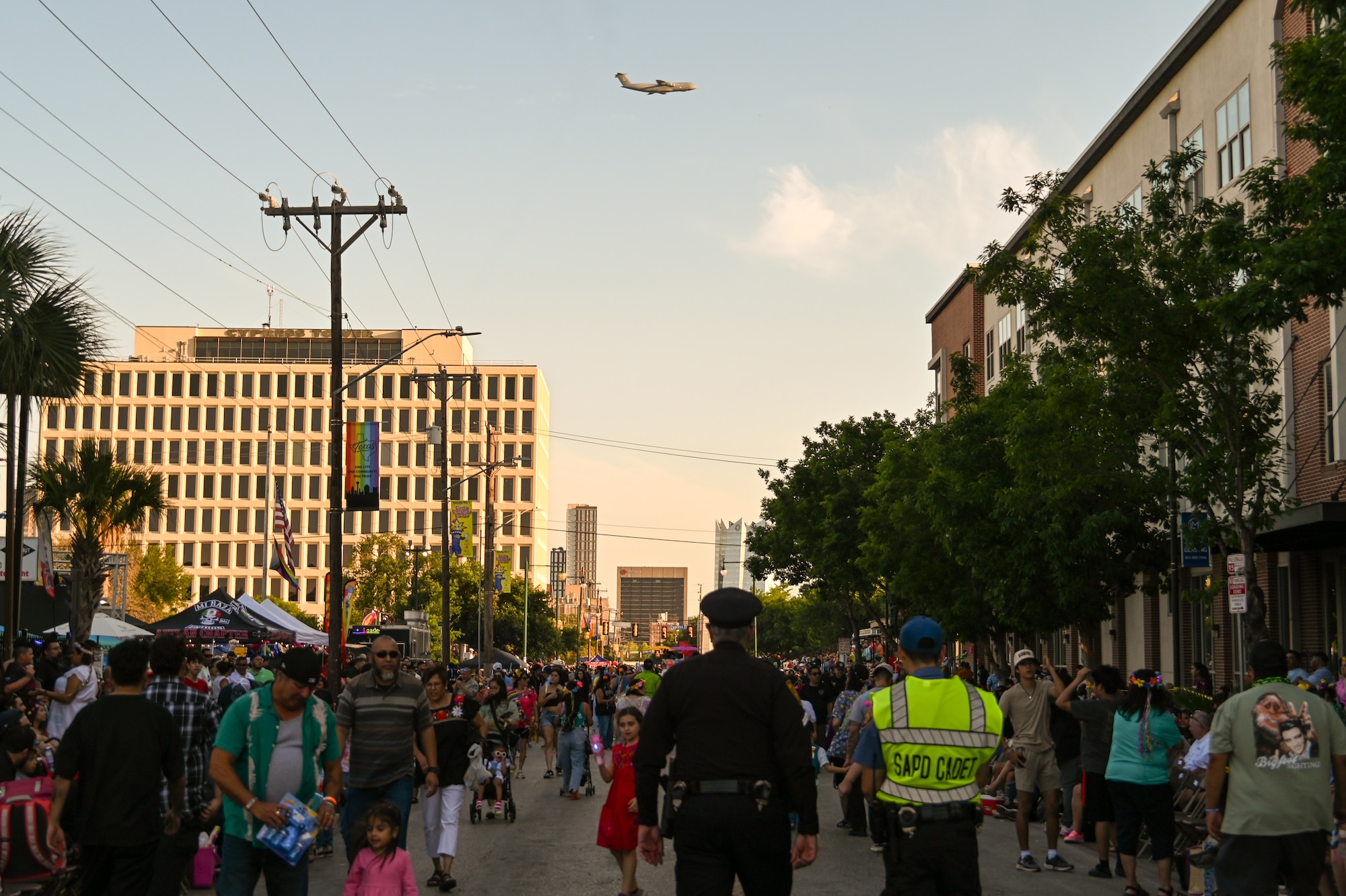 A 433rd Airlift Wing C-5M Super Galaxy performs a flyover to kickoff the 2025 Fiesta Flambeau Parade in downtown San Antonio, Texas May 3, 2025.
