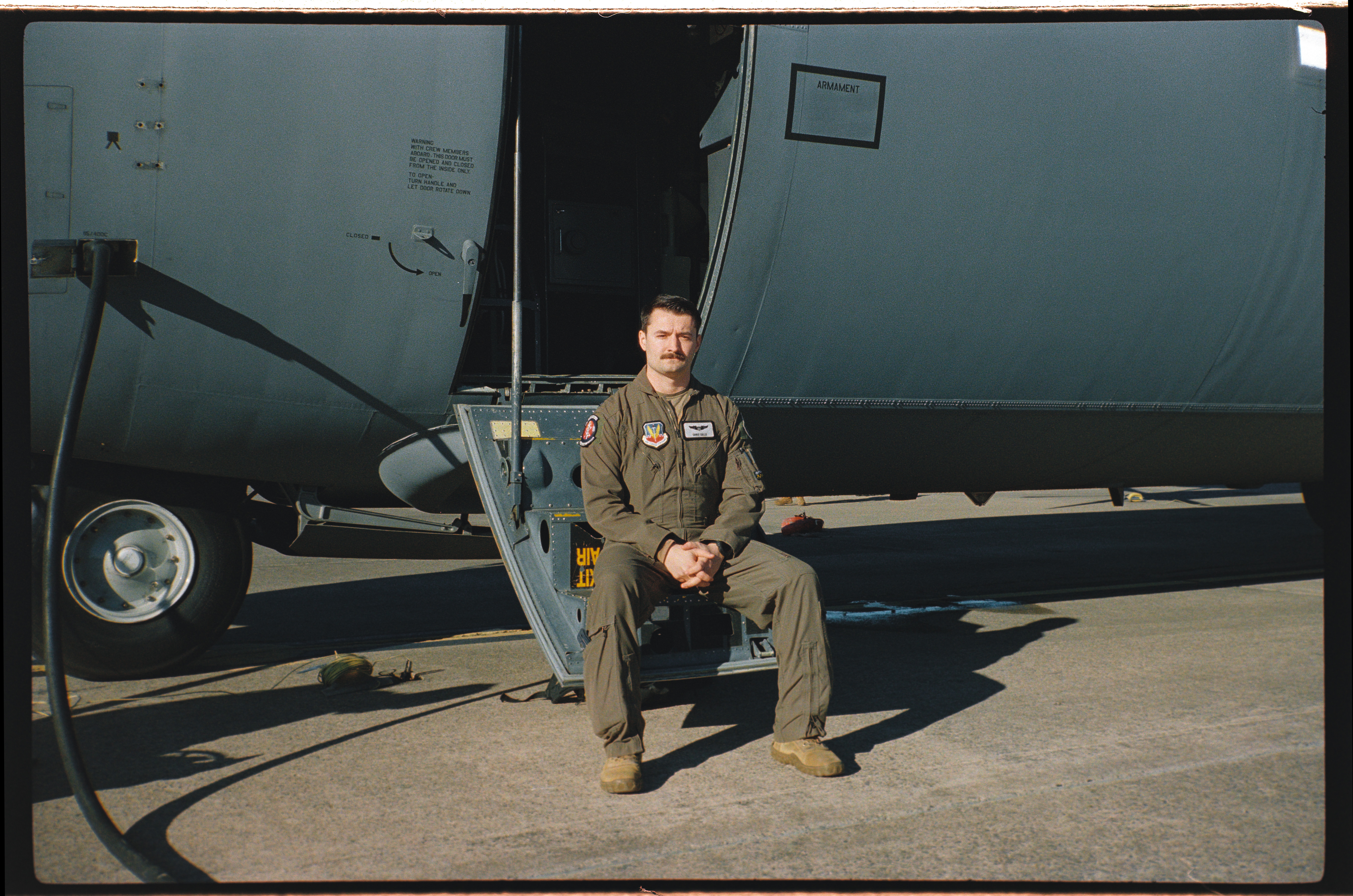 Capt. Christopher Gullo, 29th Weapons Squadron C-130 weapons officer, sits on the ramp of a C-130J Super Hercules at Little Rock Air Force Base, Ark., Jan. 22, 2025. Gullo specializes in developing advanced tactics and techniques for airlift operations in contested environments. (U.S. Air Force photo by Delano Scott)