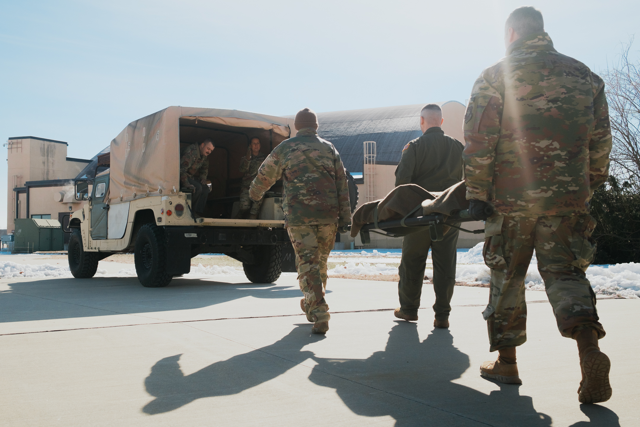 Airmen from the 375th Aeromedical Evacuation Squadron conduct a litter-carry demonstration, Jan. 24, 2025, at Scott Air Force Base, Ill. The squadron’s Air Battle Lab tests and evaluates new tactics, techniques and procedures for potential integration into Air Force-wide aeromedical evacuation operations. (U.S. Air Force photo by Delano Scott)