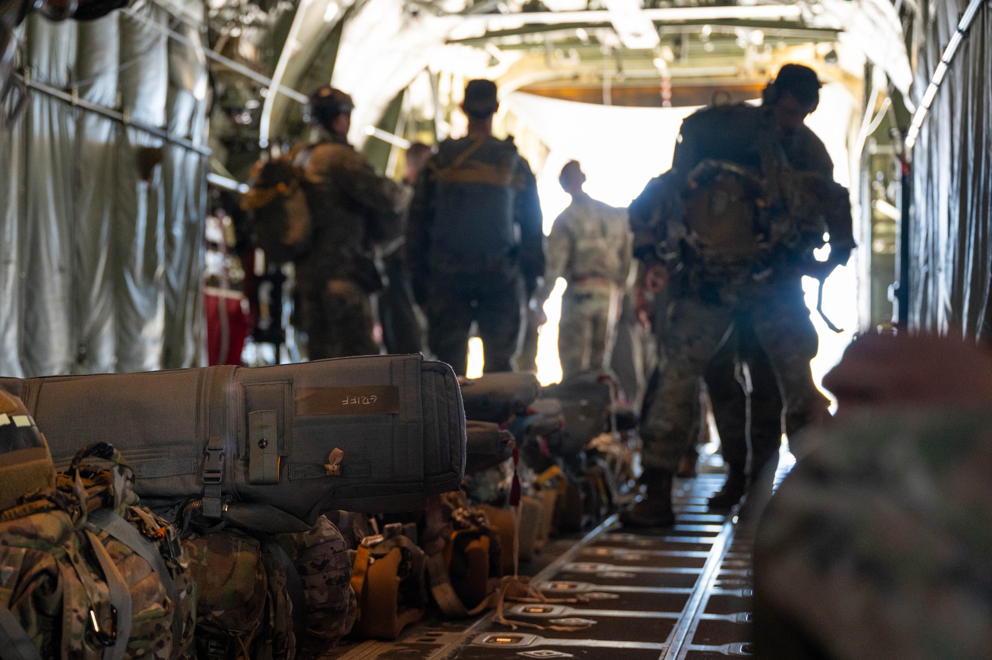 U.S. Airmen load cargo into an aircraft