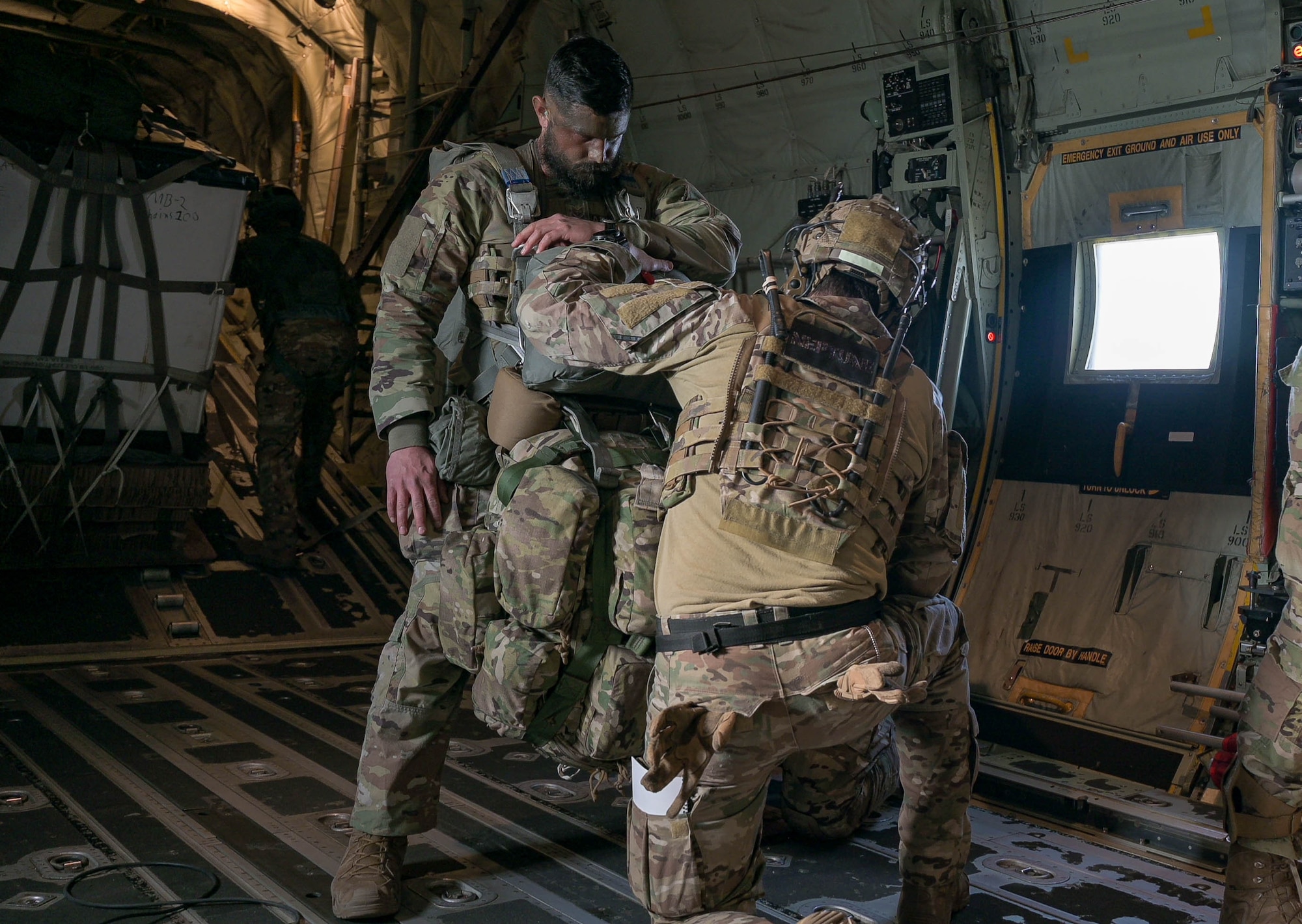 A U.S. Air Force Airman has his equipment inspected before a static-line airborne jump