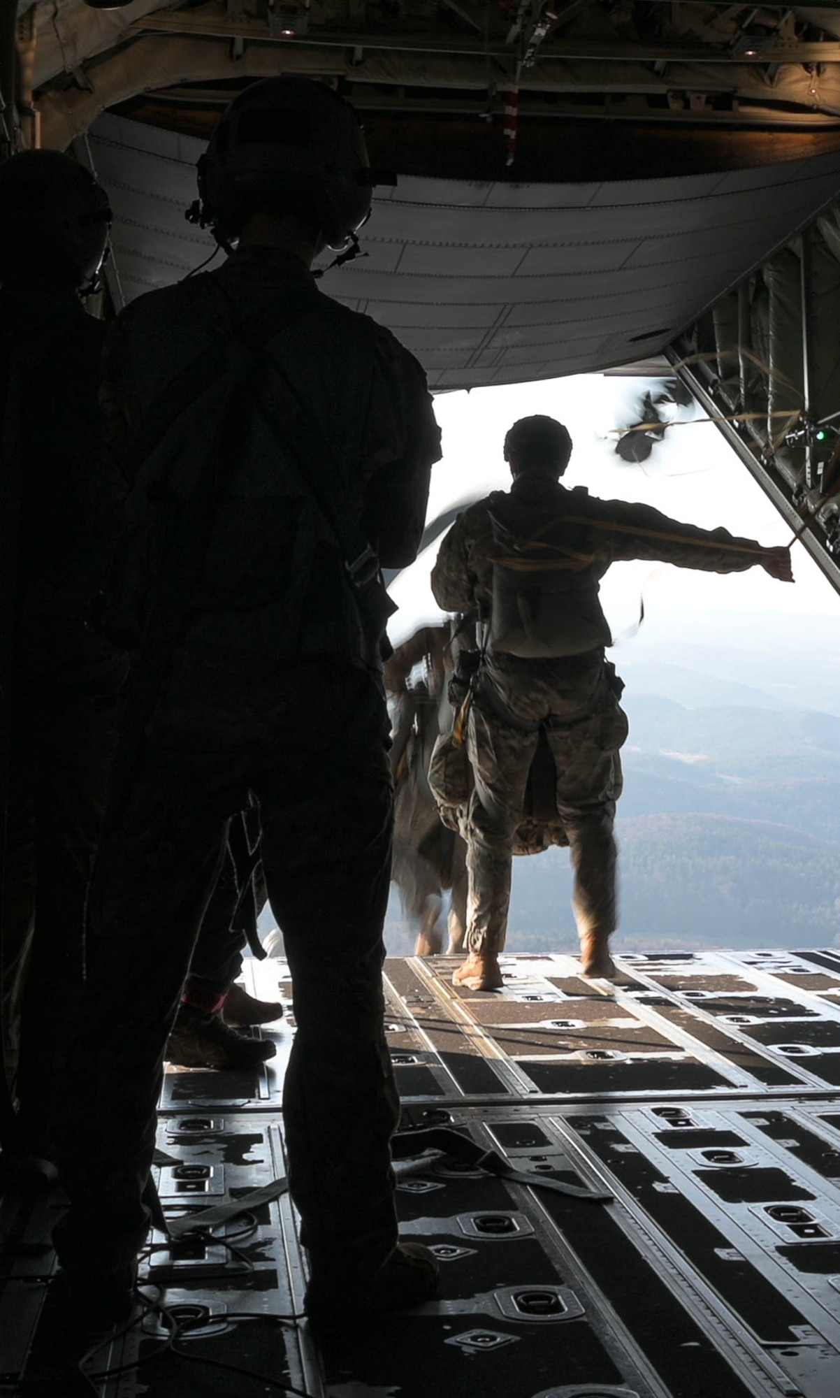 U.S. Airmen participate in a static line jump
