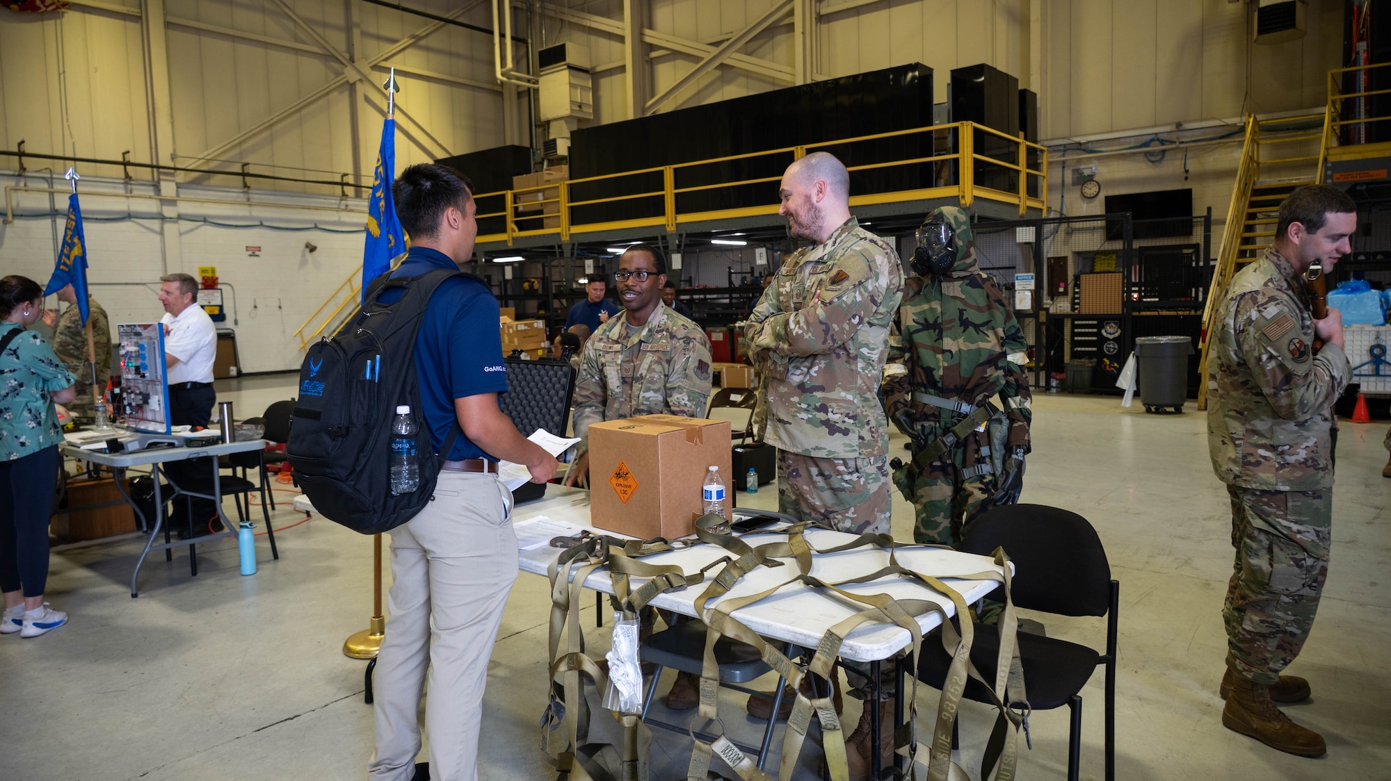 Members of the Maryland Air National Guard speak with attendees during the second day of the 175th Wing Resource Fair at Warfield Air National Guard Base at Martin State Airport, Maryland, May 4, 2025. In response to the planned divestment of the A-10C Thunderbolt II aircraft and mission, each unit of the 175th Wing spoke with Drill Status Guardsmen about their additional opportunities in the Maryland Air National Guard. (U.S. Air National Guard Photo by Airman 1st Class Sarah Hoover)