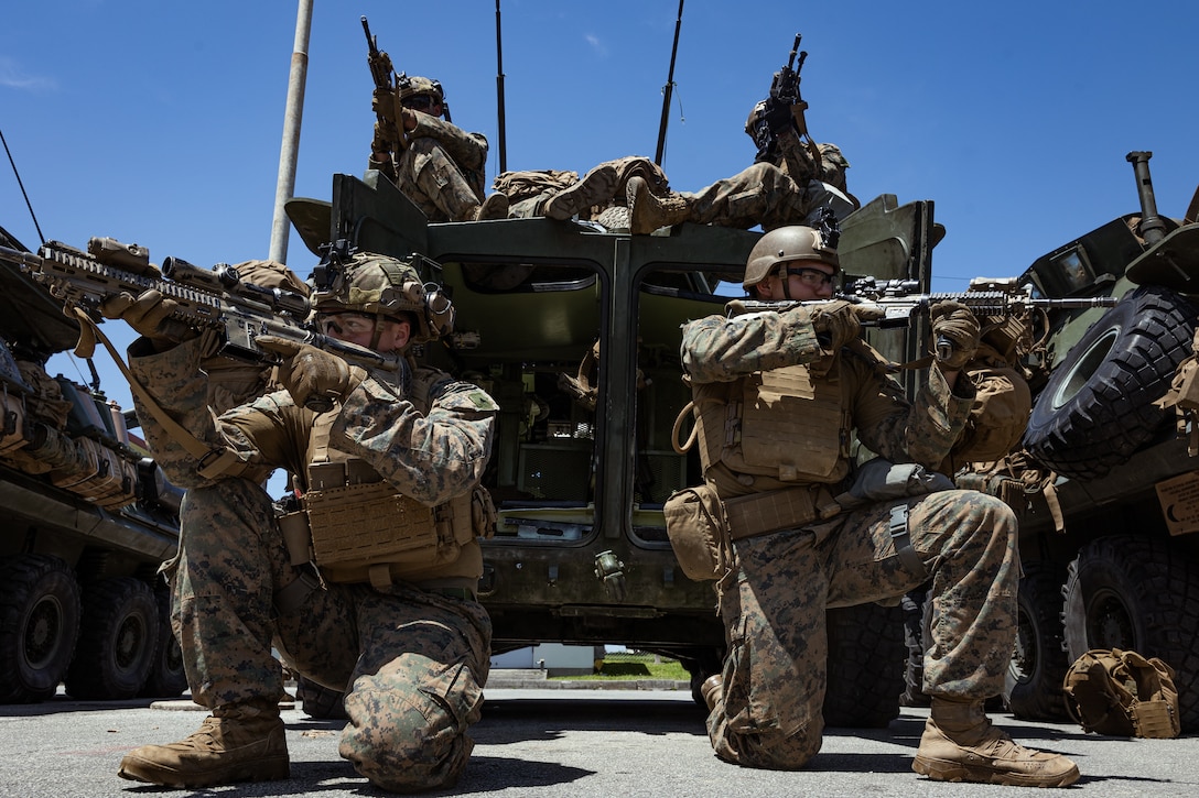 U.S. Marines with Marine with 1st Light Armored Reconnaissance Company, Battalion Landing Team 1st Battalion, 7th Marine Regiment, 31st Marine Expeditionary Unit, conduct on and off drills out of a Light Armored Vehicle while conducting a Tactical Recovery of Aircraft Personnel simulation as a part of MEU Exercise at Camp Hansen, Okinawa, Japan, May 3, 2025.