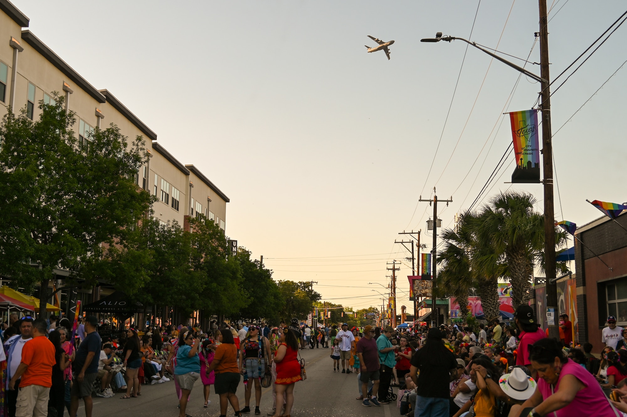 A 433rd Airlift Wing C-5M Super Galaxy performs a flyover to kickoff the 2025 Fiesta Flambeau Parade in downtown San Antonio, Texas May 3, 2025.