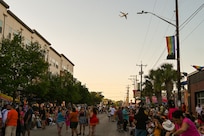A 433rd Airlift Wing C-5M Super Galaxy performs a flyover to kickoff the 2025 Fiesta Flambeau Parade in downtown San Antonio, Texas May 3, 2025.