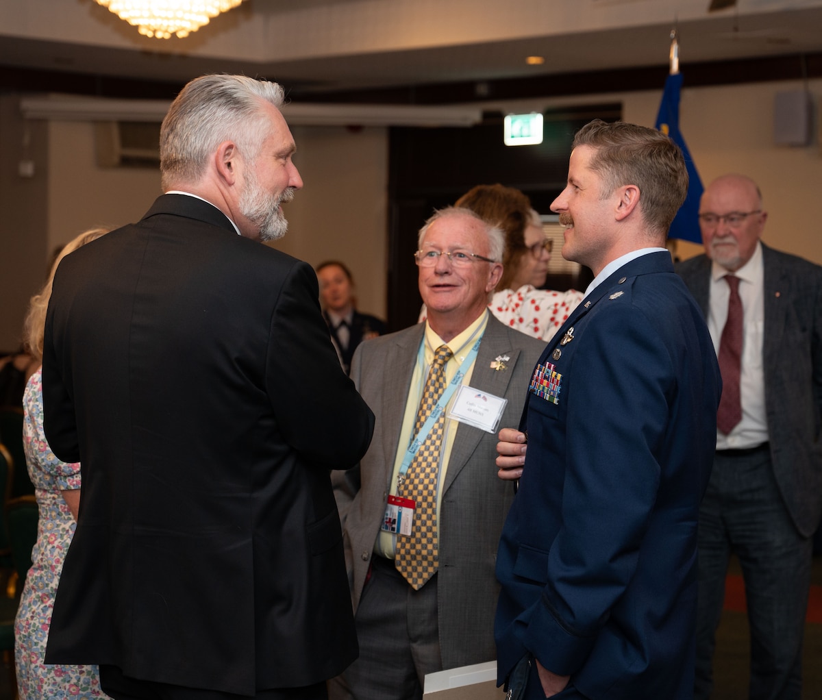 airmen and honorary commanders at a induction ceremony