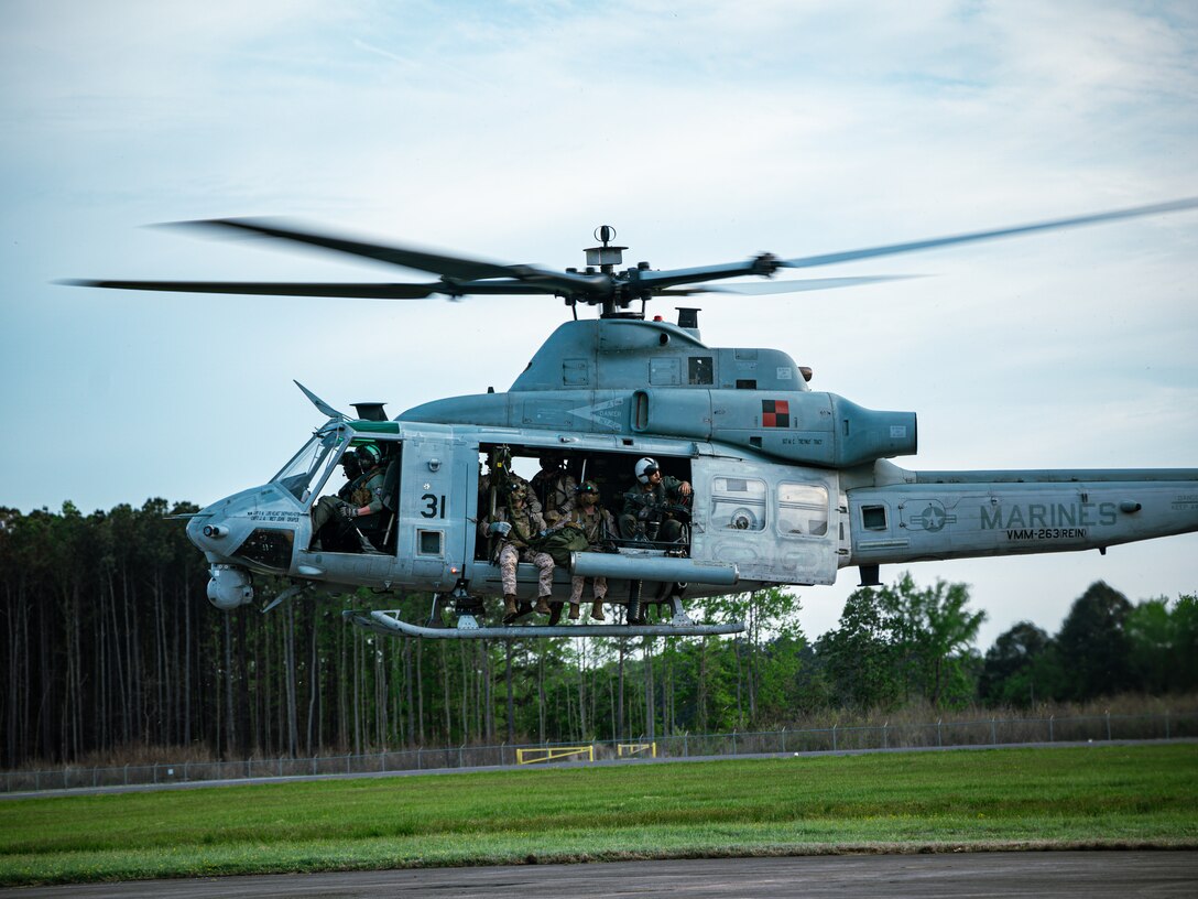 U.S. Marines with Maritime Special Purpose Force, 22nd Marine Expeditionary Unit, take off in an AH-1Z Viper with Marine Medium Tiltrotor Squadron 263, (Reinforced), 22nd MEU while conducting Visit, Board, Search, and Seizure (VBSS) training, on Fort Eustis, Virginia, April 21, 2025. Led by II Marine Expeditionary Force Expeditionary Operations Training Group, the VBSS training sharpened the 22nd MEU's edge in vessel boarding and maritime interdiction, enhancing their readiness and lethality in preparation for future operational requirements.  (U.S. Marine Corps photo by Sgt. Tanner Bernat)