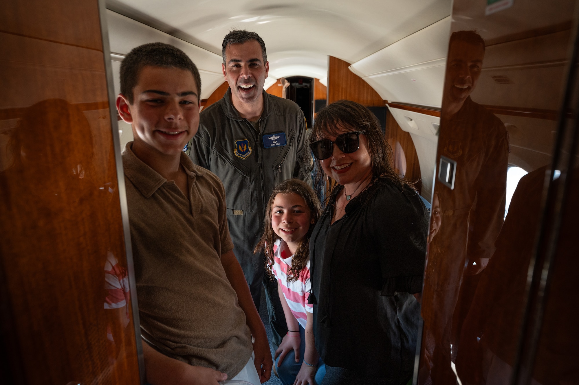 U.S. Air Force Col. Jamil I. Musa, 86th Airlift Wing deputy commander, poses for a photo with his family on a C-37A Gulfstream after his “fini flight” at Ramstein Air Base, Germany, April 29, 2025. Upon landing, Musa was greeted by family and friends to celebrate his time at Ramstein. Musa will take command of the 436th Airlift Wing at Dover Air Base, Delaware. (U.S. Air Force photo by Senior Airman Jared Lovett)