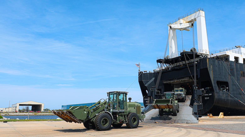 U.S. Marine Corps Maritime Prepositioning Force assets from the United States Naval Ship Seay (T-AKR 302) Roll off from the stern ramp in preparation for the Maritime Prepositioning Force Maintenance Cycle (MMC) 14 at Marine Corps Support Facility Blount Island.