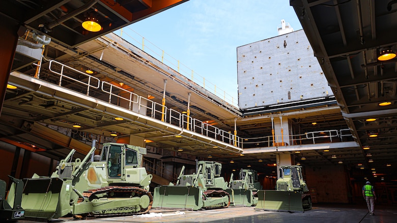 U.S. Marine Corps Maritime Prepositioning Force crawler dozers aboard the United States Naval Ship Seay (T-AKR 302) await offload in preparation for the Maritime Prepositioning Force Maintenance Cycle (MMC) 14 at Marine Corps Support Facility Blount Island.