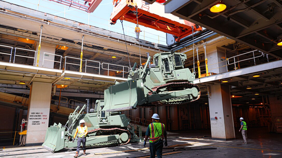 A U.S. Marine Corps Maritime Prepositioning Force crawler dozer aboard the United States Naval Ship Seay (T-AKR 302) Is hoisted off using a gantry crane in preparation for the Maritime Prepositioning Force Maintenance Cycle (MMC) 14 at Marine Corps Support Facility Blount Island.

The Maritime Prepositioning Force Maintenance Cycle (MMC) is a routine process for maintaining and replenishing the equipment and supplies carried by Maritime Prepositioning Ships (MPS). It ensures the MPS remain ready for deployment and are equipped with the necessary supplies for operations. The cycle typically lasts 42 to 45 days per ship and involves checking the serviceability of the equipment and replenishing stocks.
