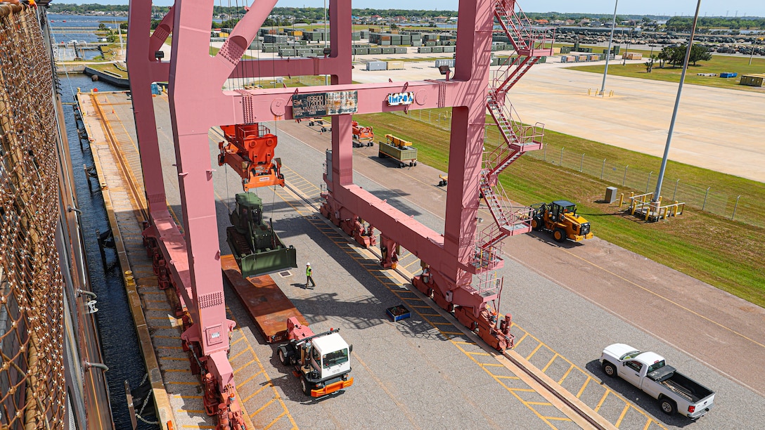 A U.S. Marine Corps Maritime Prepositioning Force crawler dozer aboard the USNS Seay (T-AKR 302) is hoisted off using a gantry crane in preparation for the Maritime Prepositioning Force Maintenance Cycle (MMC) 14 at Marine Corps Support Facility Blount Island in Florida.

The MMC is a routine process for maintaining and replenishing the equipment and supplies carried by maritime prepositioning ships. It ensures the ships remain ready for deployment and are equipped with the necessary supplies for operations. The cycle typically lasts 42 to 45 days per ship and involves checking the serviceability of the equipment and replenishing stocks.