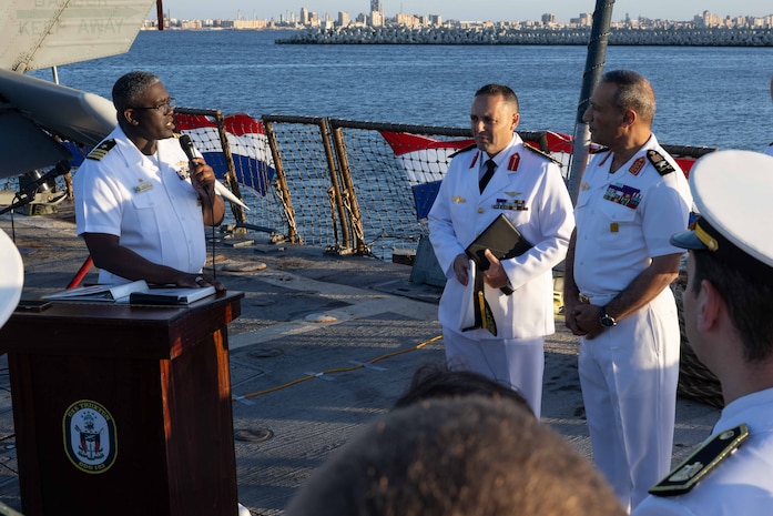 U.S. Navy Cmdr. James Koffi, commanding officer of the Arleigh Burke-class guided-missile destroyer USS Truxtun (DDG 103), left, speaks at a reception with Egyptian Navy Vice Adm. Ashraf Ibrahim Atwa Megahed, commander of the Egyptian Navy, right, in the U.S. Central Command area of responsibility.
