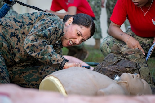 U.S. Navy Commander Flavia Soto performs Tactical Combat Care on a manikin at MacDill Air Force Base, Florida, during Operation Blue Horizon2025. OBH is a joint force exercise that reinforces core competencies and fundamental practices for military medical professionals. (Airman 1st Class Alicia Campbell)
