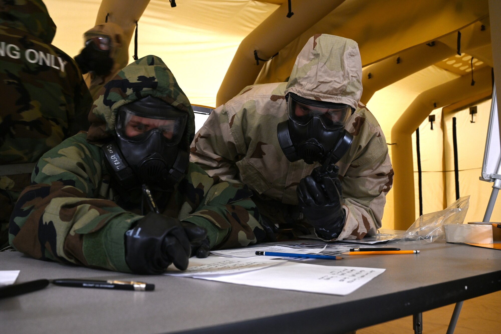 Airmen work in Mission Oriented Protective Posture gear during Ready Airmen Training.