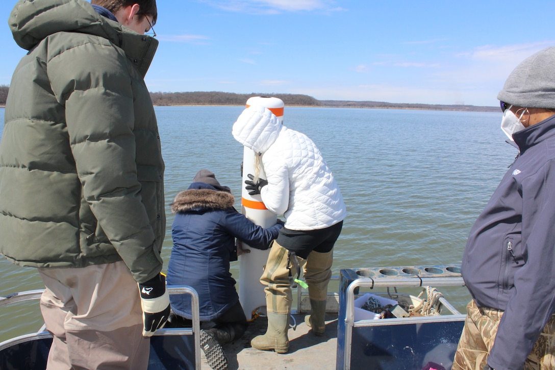 Ashley Gonzalez (USACE Jacksonville) and Megan Hamersky (Kansas Biological Survey) prepare to deploy a mooring buoy for an ERDC monitoring initiative.