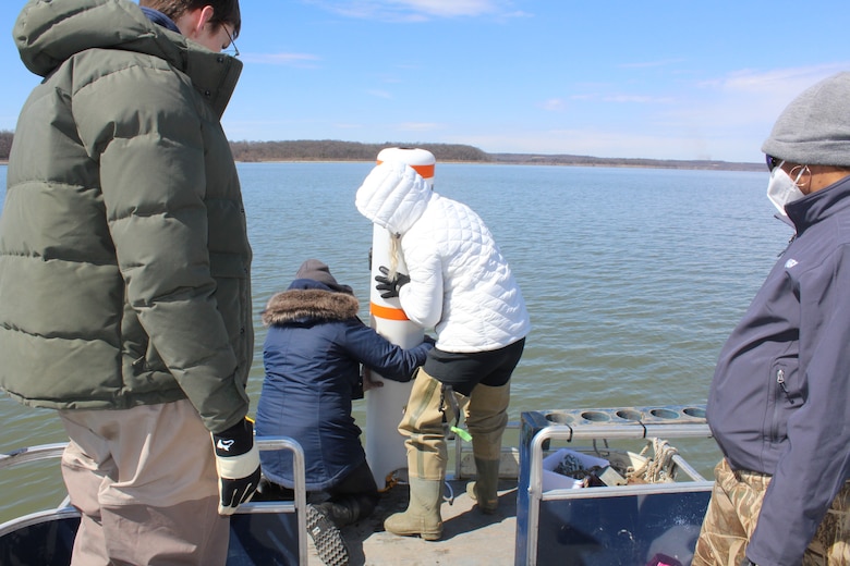 Ashley Gonzalez (USACE Jacksonville) and Megan Hamersky (Kansas Biological Survey) prepare to deploy a mooring buoy for an ERDC monitoring initiative.