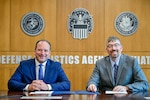 Allen Aircraft Radio Corporation Supply Chain Senior Vice President Frank Landrio and Director of Defense Logistics Agency Aviation’s Supplier Operations Original Equipment Manufacturer Directorate Travis Beasley met April 21 on Defense Supply Center Richmond, Virginia, to sign a supply chain alliance charter. The alliance aims to streamline the process of getting vital supplies into the hands of those who need them most by improving responsiveness, reducing customer wait times and shorting administrative lead times. (Photo by Nicholas Pilch)