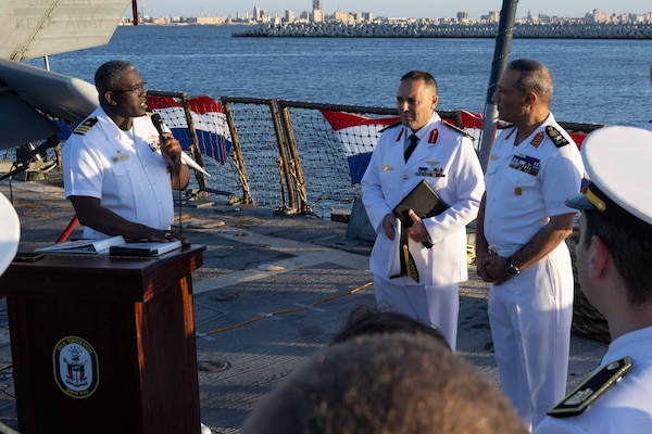 U.S. Navy Cmdr. James Koffi, commanding officer of the Arleigh Burke-class guided-missile destroyer USS Truxtun (DDG 103), left, speaks at a reception with Egyptian Navy Vice Adm. Ashraf Ibrahim Atwa Megahed, commander of the Egyptian Navy, right, in the U.S. Central Command area of responsibility.