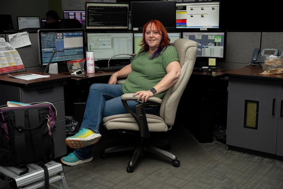 Charlotte McMurdie, emergency dispatcher, Provost Marshall’s Office, poses for a photo in her office at Marine Corps Air Station Yuma, Arizona, April 28, 2025