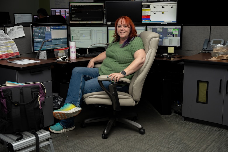 Charlotte McMurdie, emergency dispatcher, Provost Marshall’s Office, poses for a photo in her office at Marine Corps Air Station Yuma, Arizona, April 28, 2025