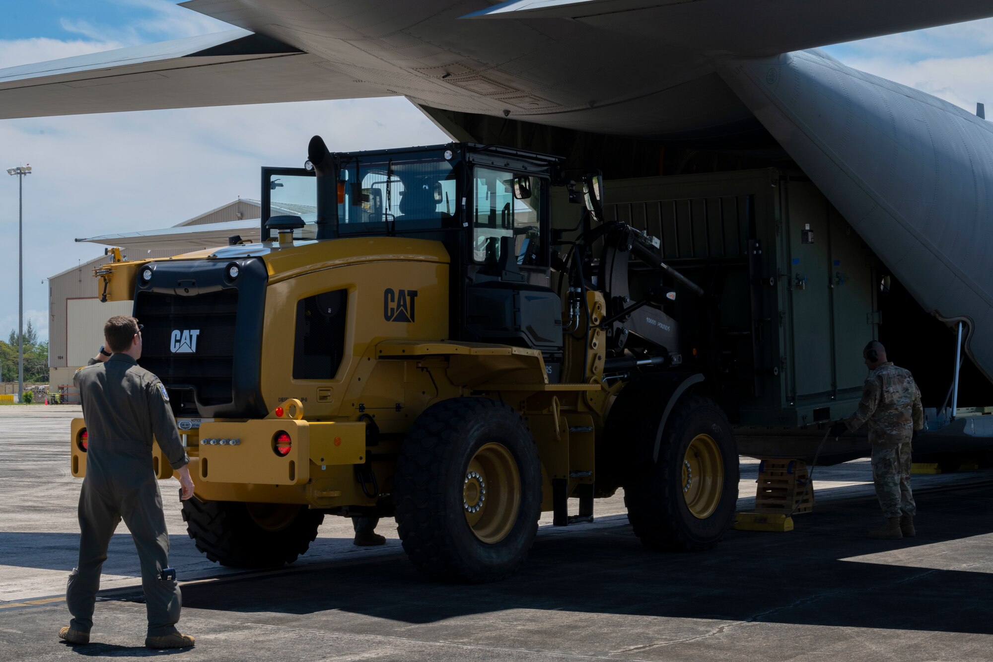 U.S. Airmen with the 156th Logistics Readiness Squadron, Puerto Rico Air National Guard, and the 123rd Airlift Wing, Kentucky Air National Guard, unload cargo from a C-130J Super Hercules aircraft assigned to the 123rd Airlift Wing, during the departure of a team with the 156th Combat Communications Squadron, Puerto Rico Air National Guard, at the 156th Wing airfield, Muñiz Air National Guard Base, Carolina, Puerto Rico, April 23, 2025. A team of approximately 25 Airmen assigned to the 156th CBCS traveled to Robins Air Force Base, Atlanta, Georgia to be evaluated on their level of proficiency in providing NIPR, SIPR, and VOIP services in an expeditionary setting as part of the Full Operating Capability (FOC) certification process. (U.S. Air National Guard photo by Senior Airman Victoria Jewett)