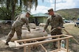 Sgt. Hanna Sturgeon, left, and Spc. Colton Hines, water purification specialists with the 935th Aviation Support Battalion, Missouri Army National Guard, prepare to test the water during the TRADEWINDS 25 (TW25) exercise at Teteron Bay, Trinidad and Tobago, April 26, 2025. TW25 is a U.S. Southern Command-sponsored and Chairman of the Joint Chiefs of Staff-approved annual exercise that bolsters regional stability and demonstrates U.S. Joint Force coordination and interoperability with Allies and partners. (U.S. Army National Guard photo by Sgt. 1st Class Benjamin Crane)