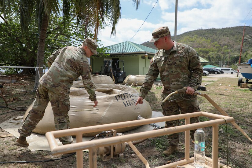 Sgt. Hanna Sturgeon, left, and Spc. Colton Hines, water purification specialists with the 935th Aviation Support Battalion, Missouri Army National Guard, prepare to test the water during the TRADEWINDS 25 (TW25) exercise at Teteron Bay, Trinidad and Tobago, April 26, 2025. TW25 is a U.S. Southern Command-sponsored and Chairman of the Joint Chiefs of Staff-approved annual exercise that bolsters regional stability and demonstrates U.S. Joint Force coordination and interoperability with Allies and partners. (U.S. Army National Guard photo by Sgt. 1st Class Benjamin Crane)
