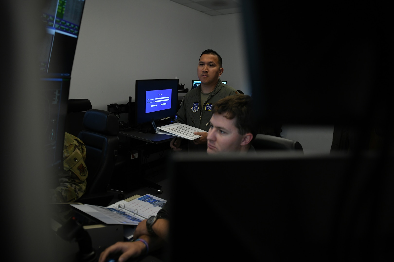 U.S. Air Force Maj. Angelo Tapalla, 196th Attack Squadron, California Air National Guard, grades members of the 15th Attack Squadron, Creech Air Force Base, Nev., during Reaper Smoke, March Air Reserve Base, Calif., April 23, 2025.