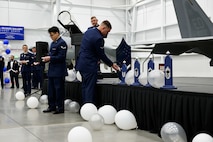 Airmen build the chief master sergeant rank during the enlisted heritage portion of a Chief Master Sergeant Recognition Ceremony at Hill Air Force Base, Utah, May 2, 2025. Reaching the rank of chief master sergeant is a significant milestone, achieved by only 1% of the total enlisted force in the U.S. Air Force. The event celebrated the hard work and dedication of the new chiefs while reinforcing the standards expected of those who wear the rank of chief master sergeant. (U.S. Air Force photo by R. Nial Bradshaw)