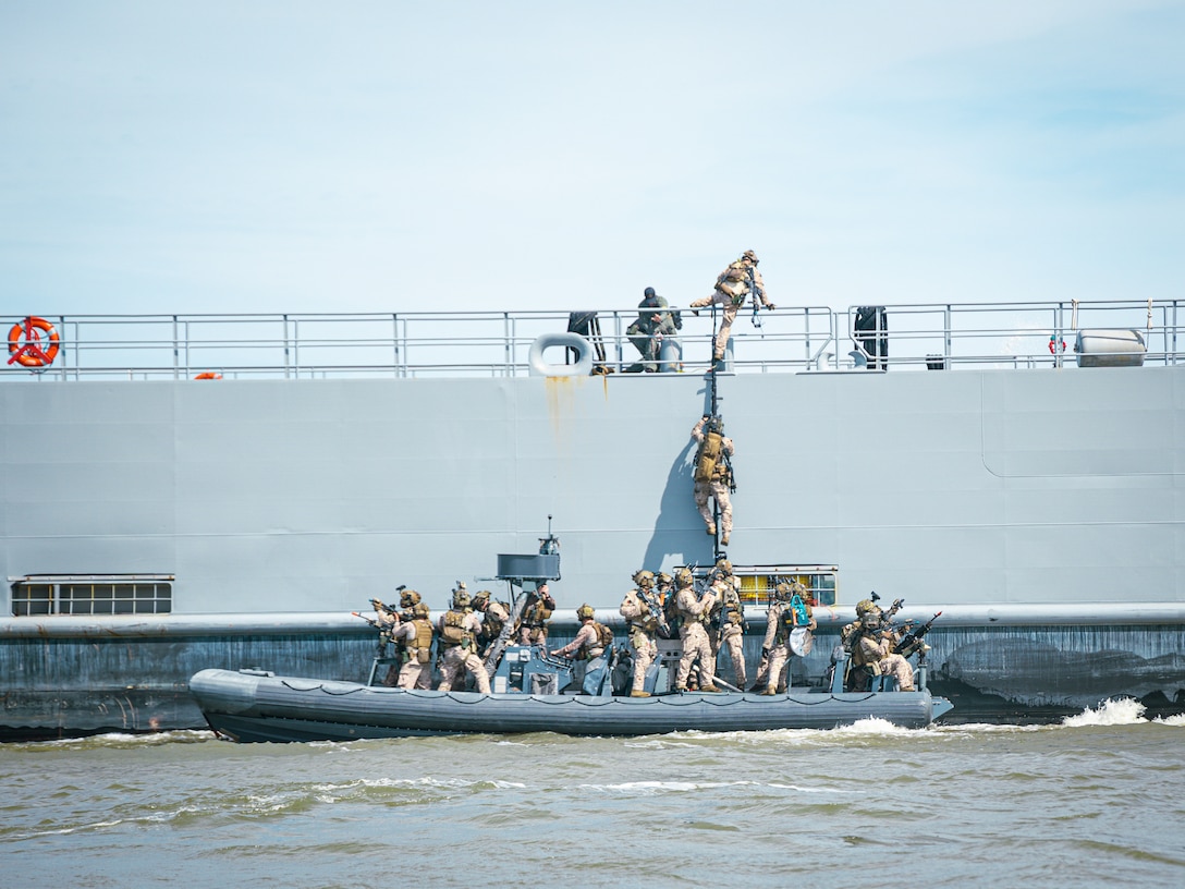U.S. Marines with 22nd Marine Expeditionary Unit board U.S. Army Vessel Major General Charles P. Gross (LSV-5) while conducting Visit, Board, Search, and Seizure (VBSS) training, on the James River near Fort Eustis, Virginia, April 24, 2025. Led by II Marine Expeditionary Force Expeditionary Operations Training Group, the VBSS training sharpened the 22nd MEU's edge in vessel boarding and maritime interdiction, enhancing their readiness and lethality in preparation for future operational requirements. (U.S. Marine Corps photo by Sgt. Tanner Bernat)