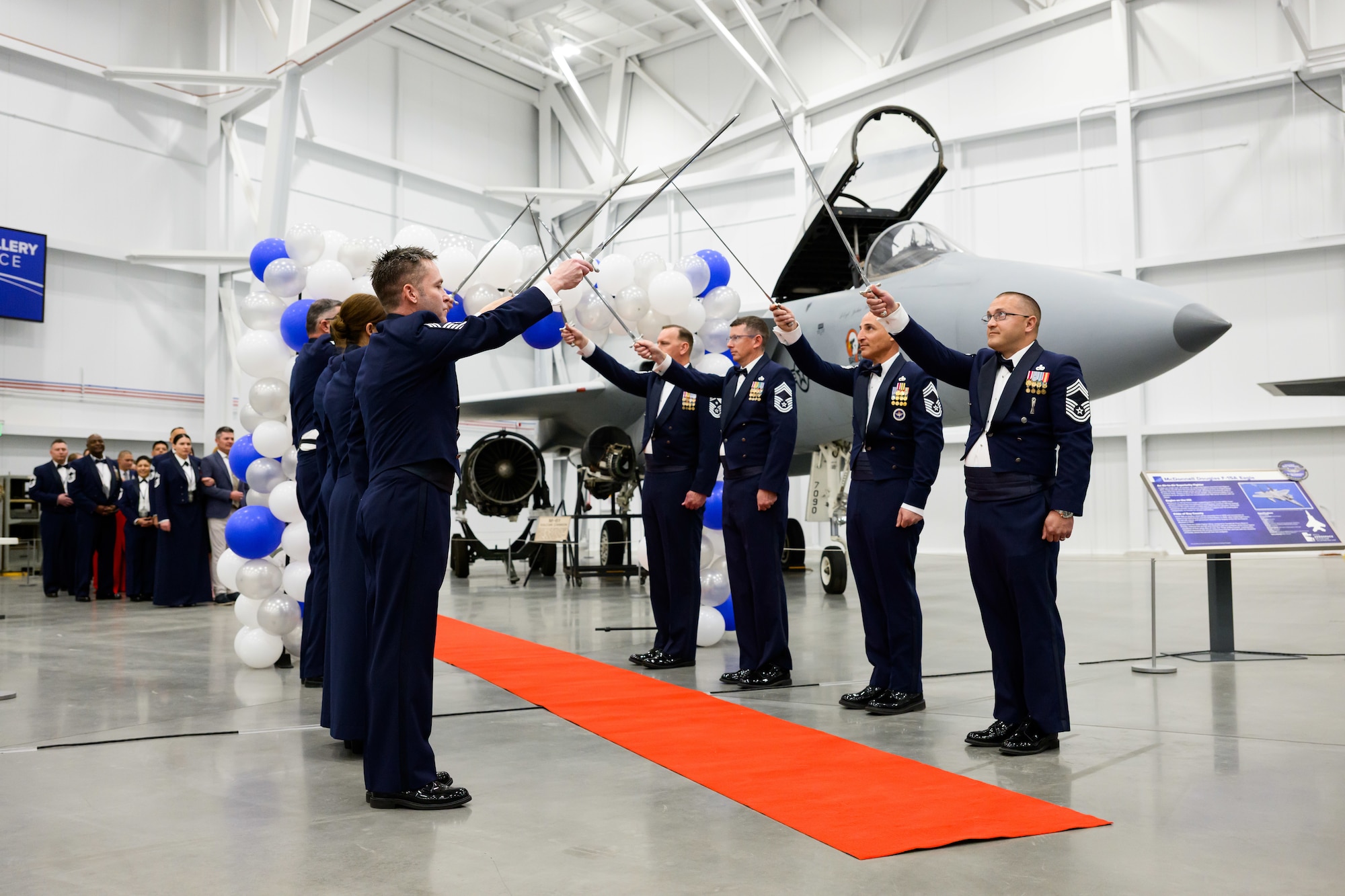 Chief master sergeants form a saber cordon for inductees to walk through during a Chief Master Sergeant Recognition Ceremony at Hill Air Force Base, Utah, May 2, 2025. Reaching the rank of chief master sergeant is a significant milestone, achieved by only 1% of the total enlisted force in the U.S. Air Force. The event celebrated the hard work and dedication of the new chiefs while reinforcing the standards expected of those who wear the rank of chief master sergeant. (U.S. Air Force photo by R. Nial Bradshaw)