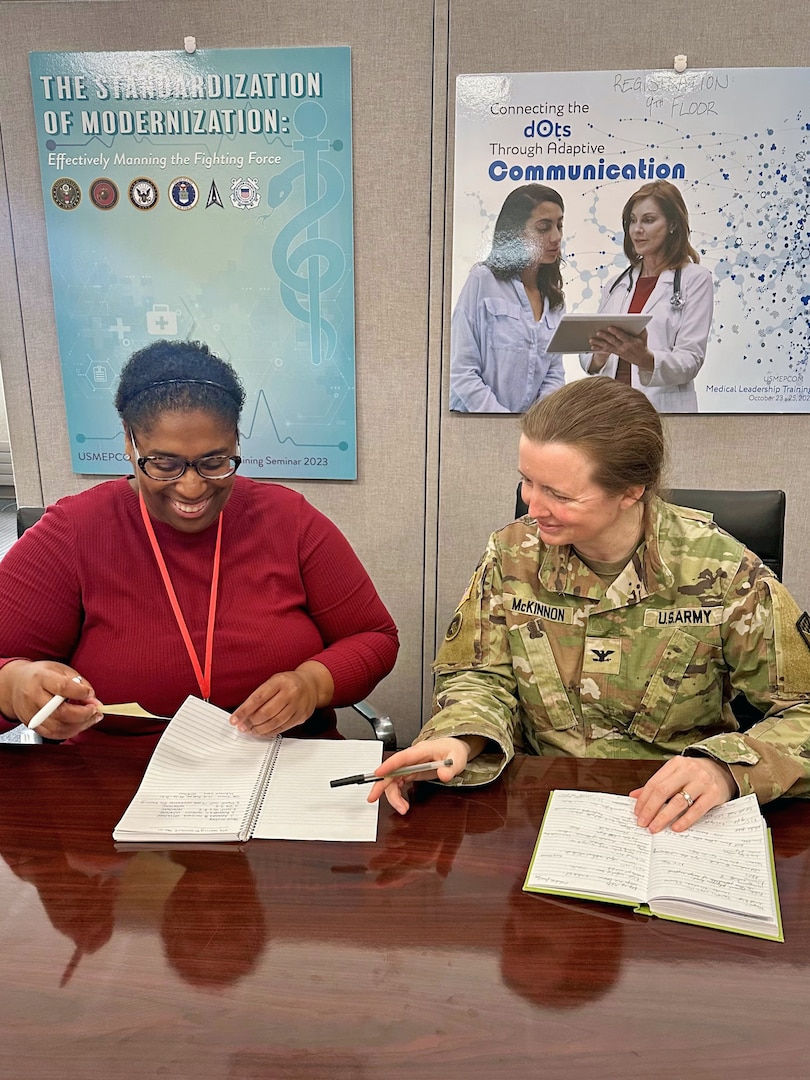 (L) Dr. Ashley Jackson, director of USMEPCOM's newly established Provider Quality Management Program Office (PQMPO) collaborates with Army Col. Megan McKinnon, USMEPCOM command surgeon. USMEPCOM launched the PQMPO to centralize oversight and standardize medical evaluations for military applicants amid evolving technology and policy demands.