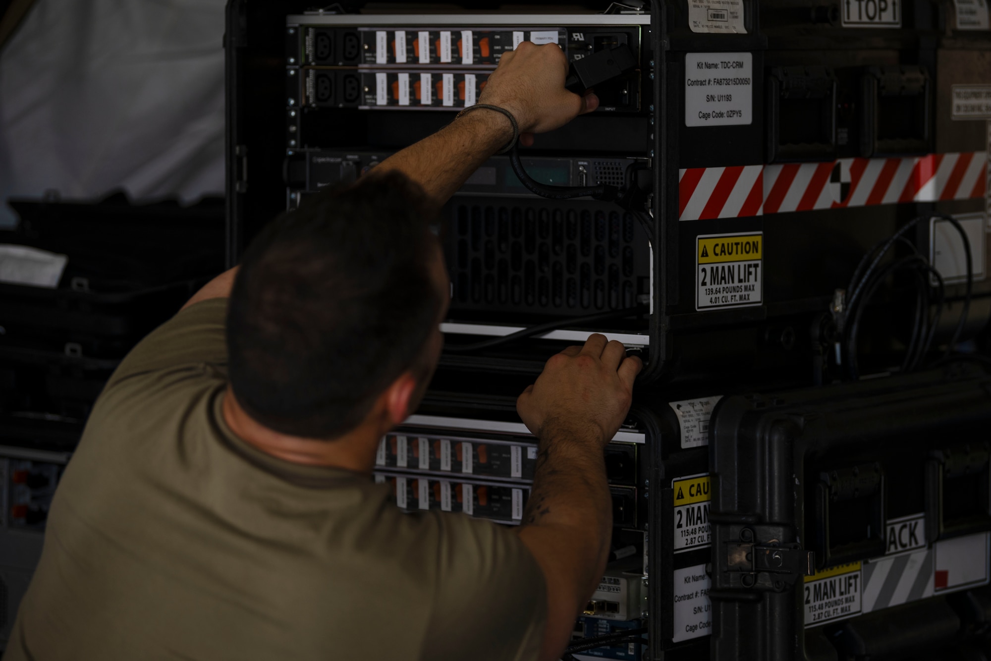 U.S. Air Force Airman 1st Class Francisco Alcina, a cyber transport journeyman, with the 156th Combat Communications Squadron, Puerto Rico Air National Guard, assembles an expeditionary communication package during a Full Operating Capability (FOC) evaluation at Punta Salinas Air National Guard Station, Toa Baja, Puerto Rico, April 24, 2025. A team of approximately 25 Airmen assigned to the 156th CBCS were evaluated on their level of proficiency in providing NIPR, SIPR, and VOIP services in an expeditionary setting as part of the FOC certification process. (U.S. Air National Guard photo by Senior Airman Victoria Jewett)