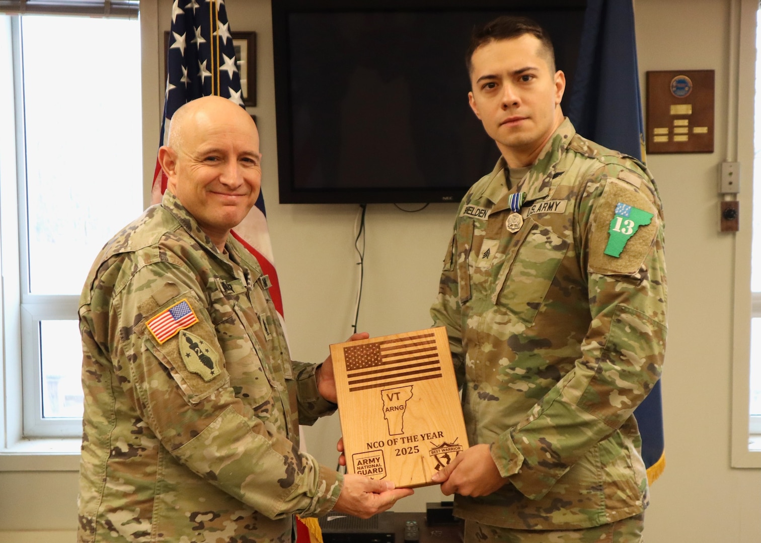 U.S. Army Command Sgt. Maj. Robert Palmer (left) and Spc. Eli Nielsen, Vermont National Guard, receives awards at the end of the Best Warrior Competition