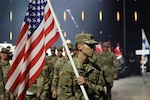 U.S. Army Spc. Caleb Hunter, Maine National Guard, leads team U.S.A. with the flag over his shoulder during the opening ceremony of the CISM 2025 World Winter Military Games