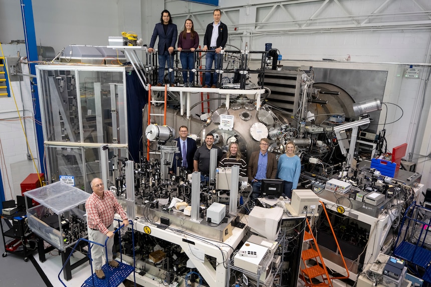 Members of the Laser Plasma Branch at the U.S. Naval Research Laboratory join visitors from fellows defense research agencies for a group photo in the NIKE target area in Washington, D.C., Oct. 25, 2024. The visit featured a tour of the NIKE laser facility to promote potential collaborative experiments in reactive materials research. (U.S. Navy photo by Sarah Peterson)