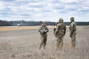 Students and staff with the Air Force’s Air Mobility Liaison Officer (AMLO) Qualification Course complete training April 15, 2025 at Young Air Assault Strip on South Post at Fort McCoy, Wis. Lt. Col. Andrew Baker, course director with the 435th Training Squadron at Scott Air Force Base, Ill., said the class previously conducted this training in Colorado, but for the first time brought the AMLO students to Fort McCoy because of the capabilities found on the post. During the week of their training, they focused on drop zone control and landing zone safety officer training. (U.S. Army Photo by Kevin Clark/Fort McCoy Multimedia-Visual Information Office)