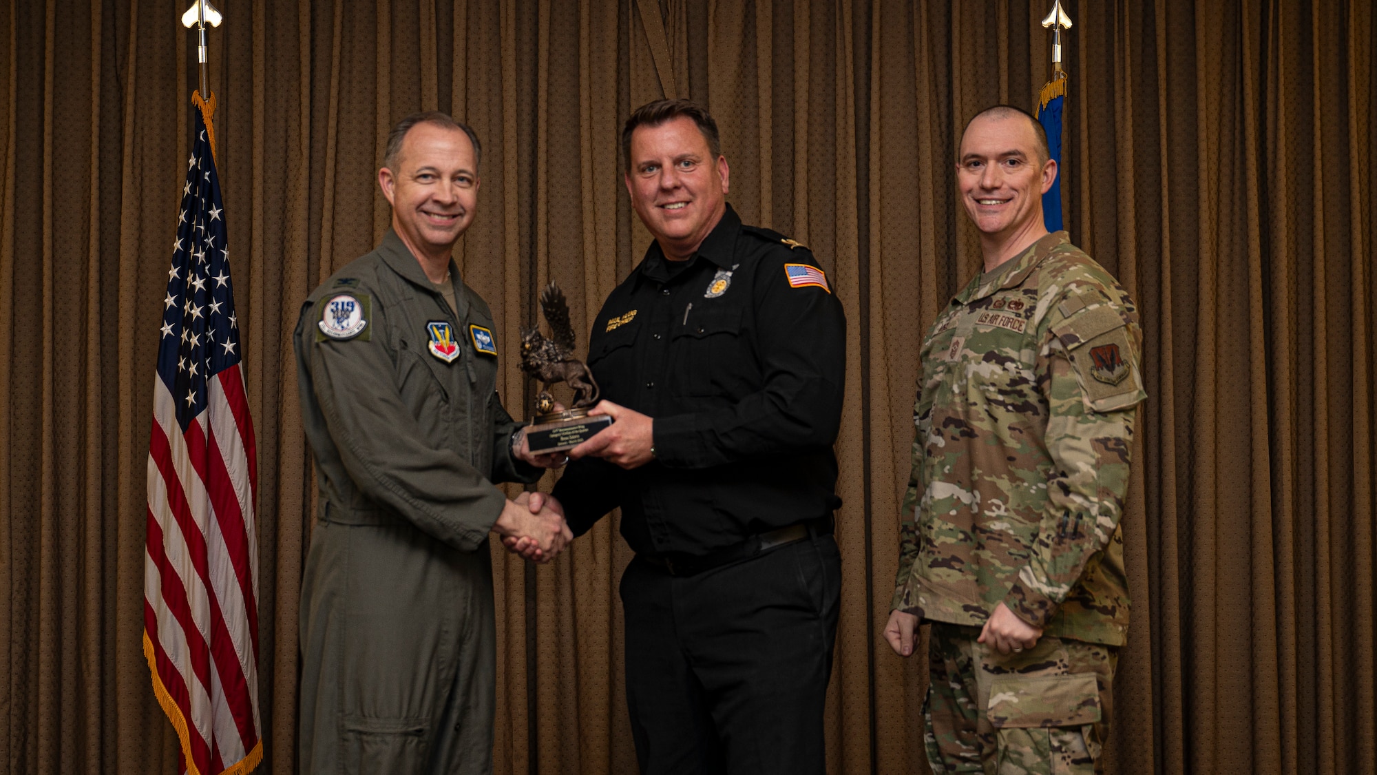 Mr. Beau Saiers, 319th Civil Engineering Squadron, accepts the Category I Civilian of the Quarter Award, during the 319th Reconnaissance Wing’s 1st quarter award ceremony at Grand Forks Air Force Base, North Dakota, May 2, 2025.