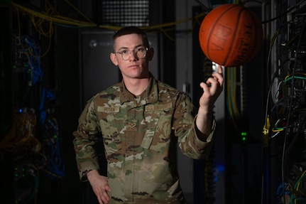 U.S. Air National Guard Senior Airman Landon Potvin, an operations support specialist assigned to the 158th Fighter Wing, pauses his duties to take an environmental portrait for an airman spotlight story