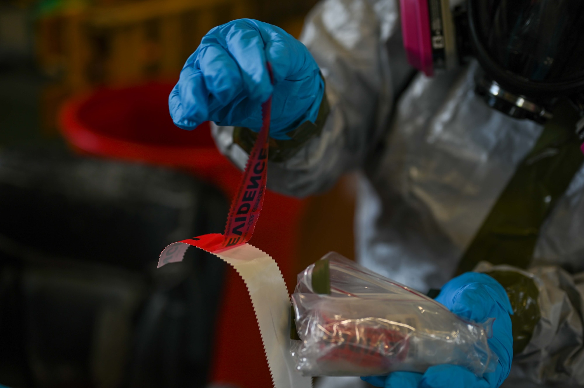 A U.S. Air Force Airman labels simulated hazardous materials.