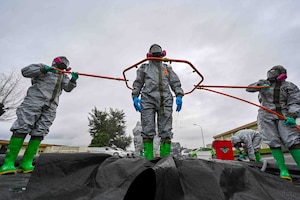U.S. Air Force Airmen perform decontamination procedures.