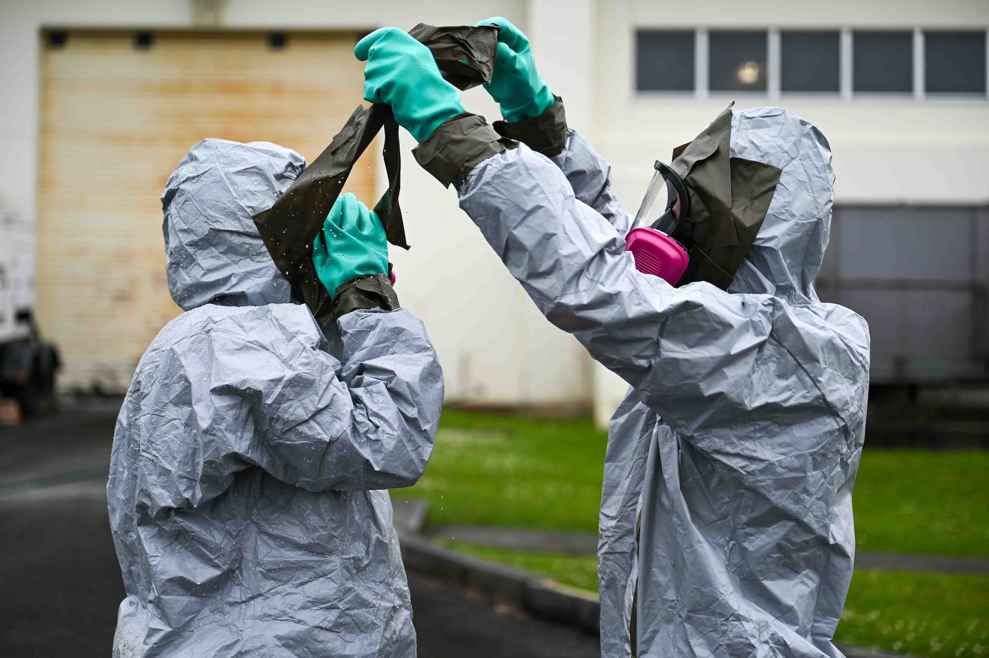 U.S. Air Force Airmen perform decontamination procedures.