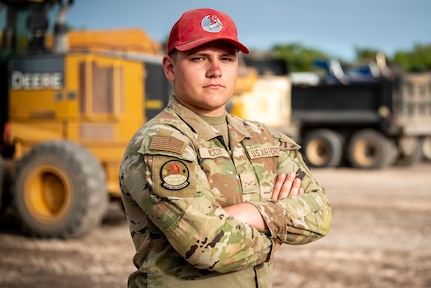 U.S. Air Force Airman First Class Braylon McCoy, pavements and heavy equipment operator assigned to the 200th Rapid Engineer Deployable Heavy Operational Repair Squadron Engineer (RED HORSE) Squadron, Mansfield, Ohio, poses for a portrait at Northwest Field, Andersen Air Force Base, Guam, April 7, 2025.