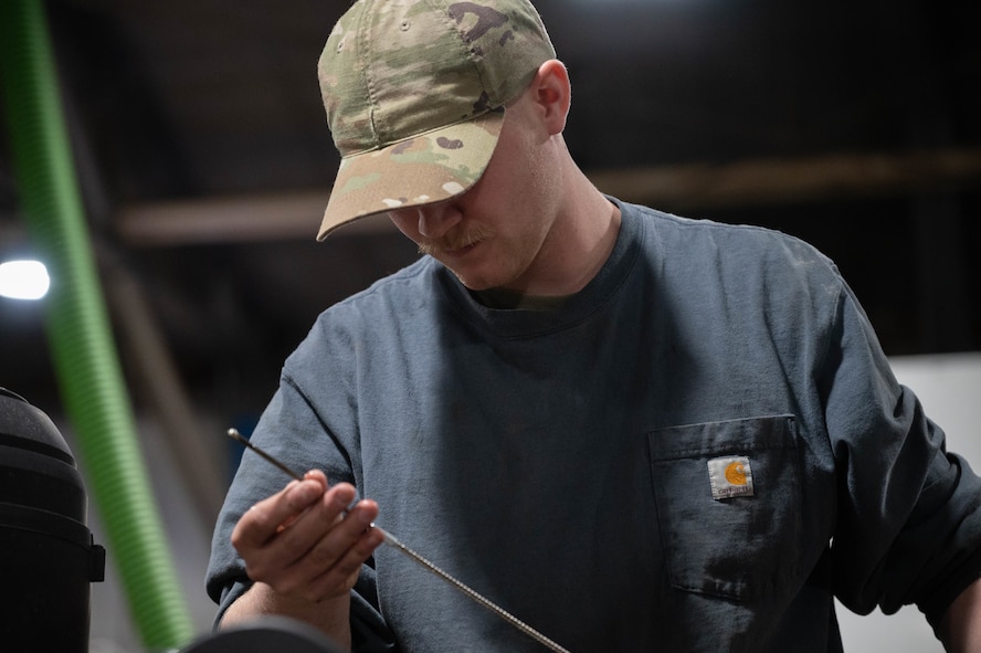 Airman 1st Class Marshal Bergerson, 5th Logistics Readiness Squadron vehicle maintainer, checks the oil level on a Joint Light Tactical Vehicle (JLTV) at Minot Air Force Base, North Dakota, April 30, 2025. The JLTV program aims to create a family of vehicles that could perform multiple missions, offering protected and sustained mobility for personnel and payload. (U.S. Air Force photo by Airman 1st Class Wesley Davies)