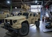 An Airman assigned to the 5th Logistics Readiness Squadron vehicle maintenance flight moves a Joint Light Tactical Vehicle (JLTV) into position for maintenance at Minot Air Force Base, North Dakota, April 30, 2025. The JLTV can be considered an improved version of the High Mobility Multipurpose Wheeled Vehicle (Humvee) with better armor, agility, and fuel efficiency plus a greater payload capacity. (U.S. Air Force photo by Airman 1st Class Wesley Davies)